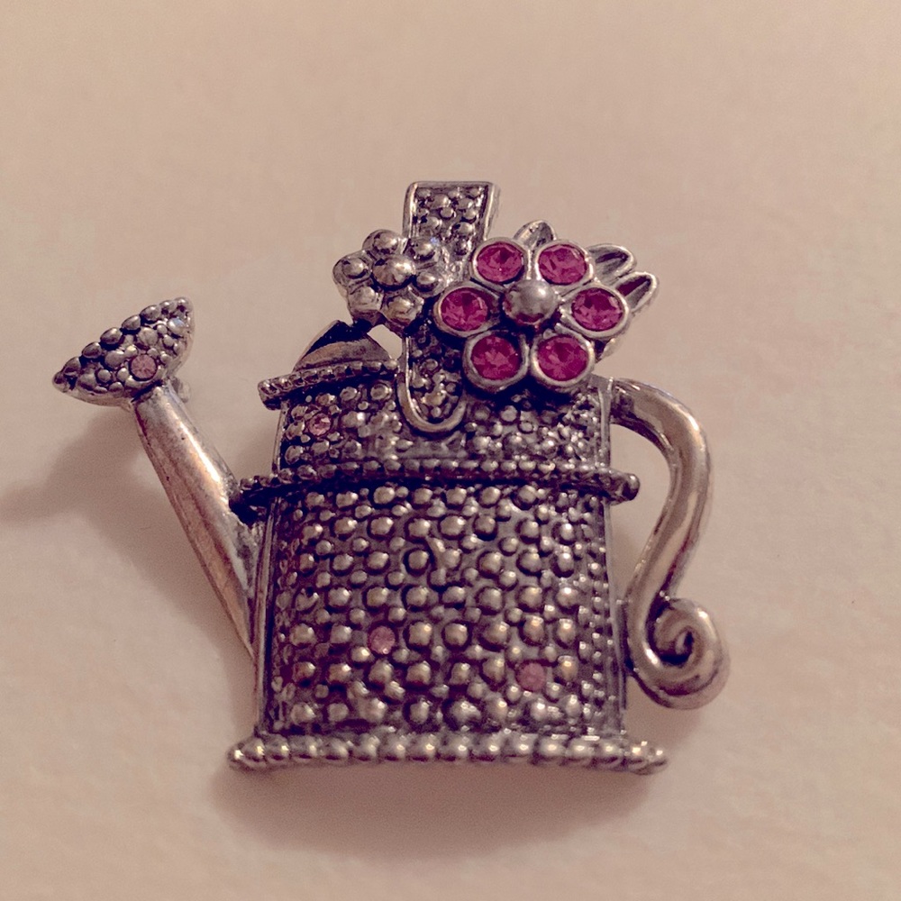 Costume silver-tone brooch with pink stones